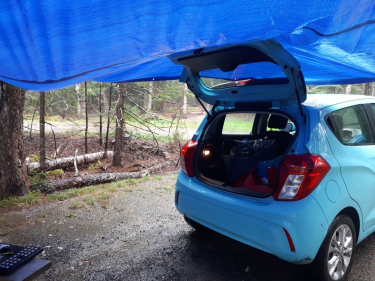 small car under a tarp