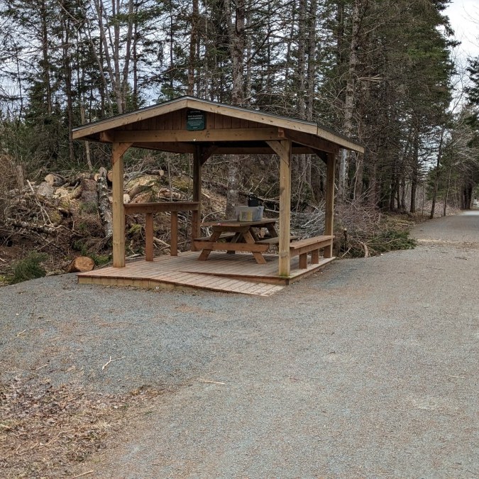 Covered accessible picnic table near the western entrance of the Gaetz Brook Greenway.